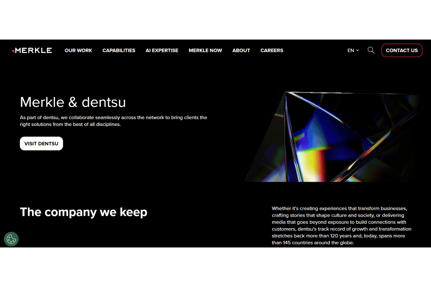 Merkle-website met de sectie 'Merkle & dentsu', een knop Bezoek Dentsu en een geometrische prisma-afbeelding.
