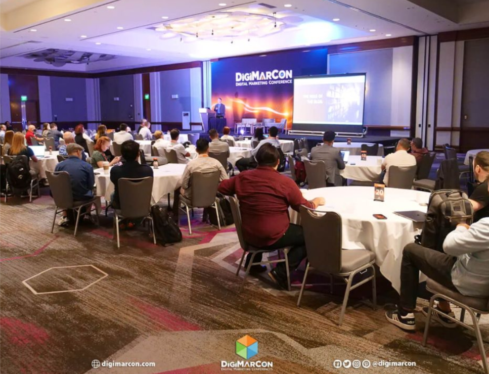 A photo of the attendees and the speaker at the DigiMarCon conference