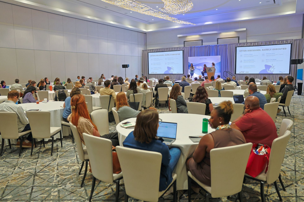 Engaged audience listening to a panel discussion at the B2B Marketing Exchange