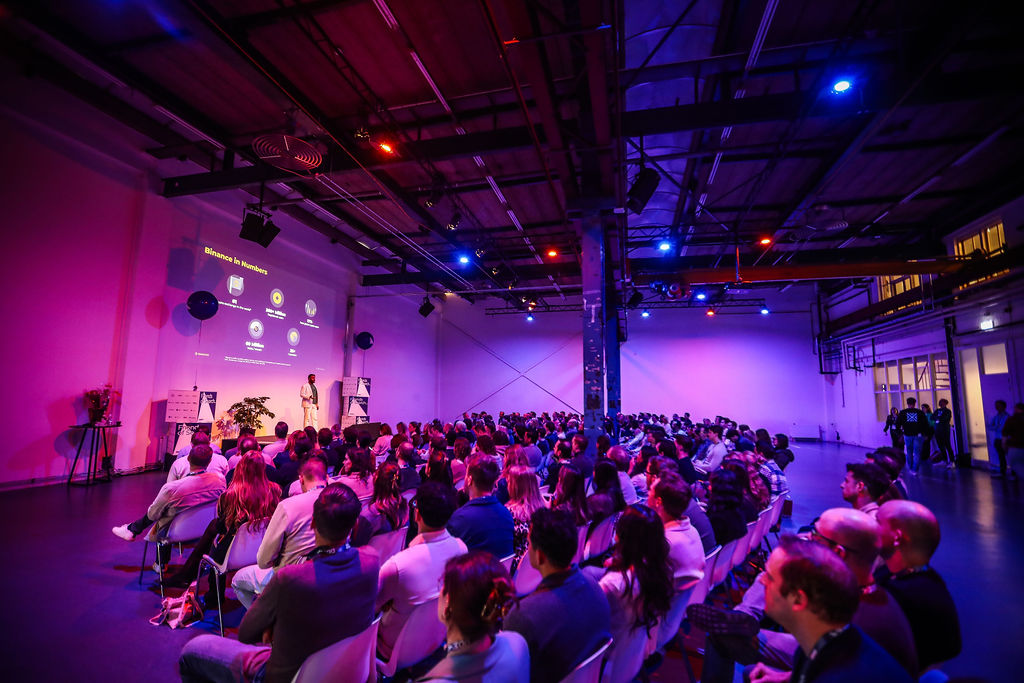 A packed audience engaged in learning at Friends of Search