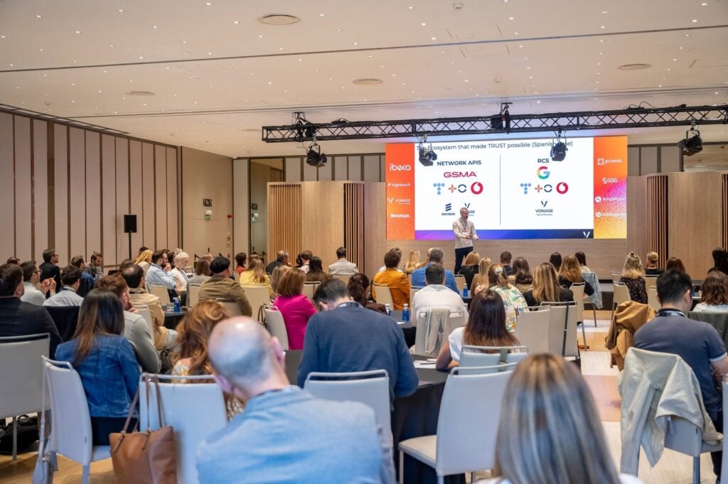 A speaker presenting to an audience during a conference session at The MarTech Summit