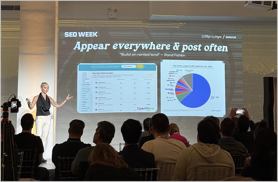 Audience members engaged in a live presentation at SEO Week