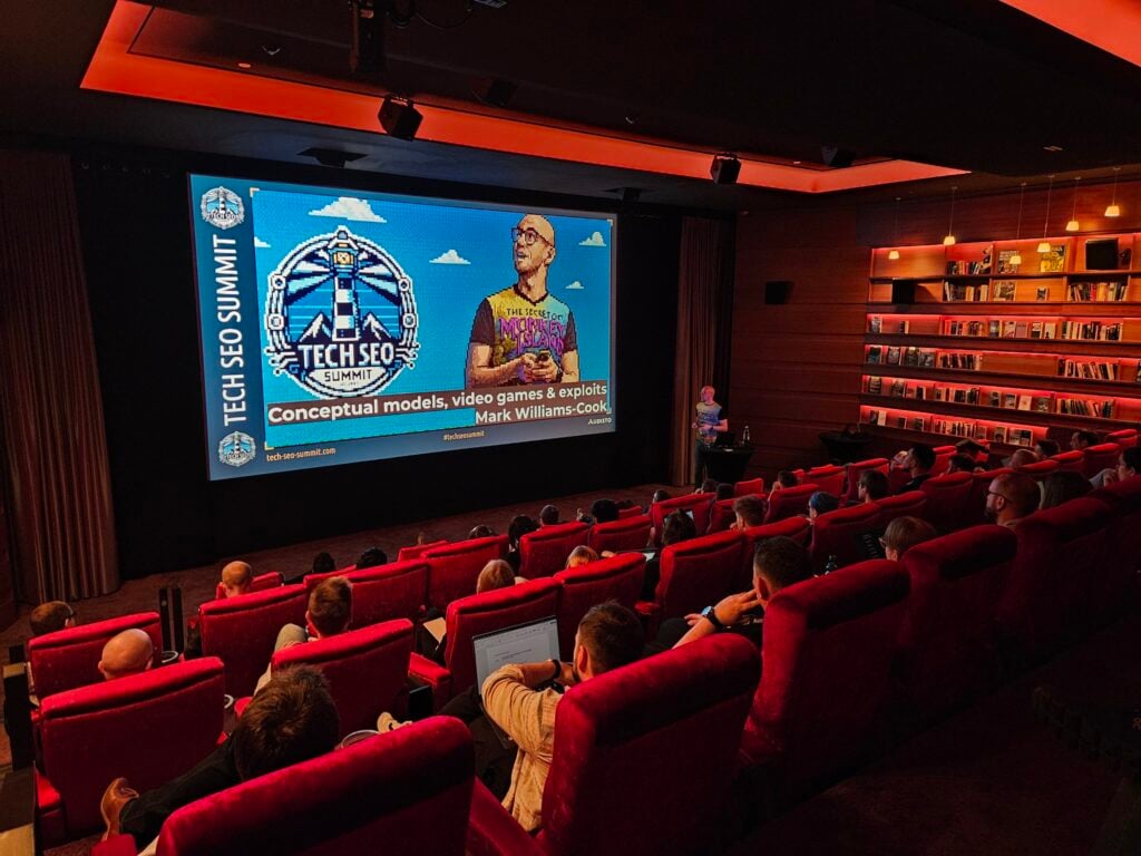 Conference attendees focused on an in-depth technical SEO presentation at the Tech SEO Summit