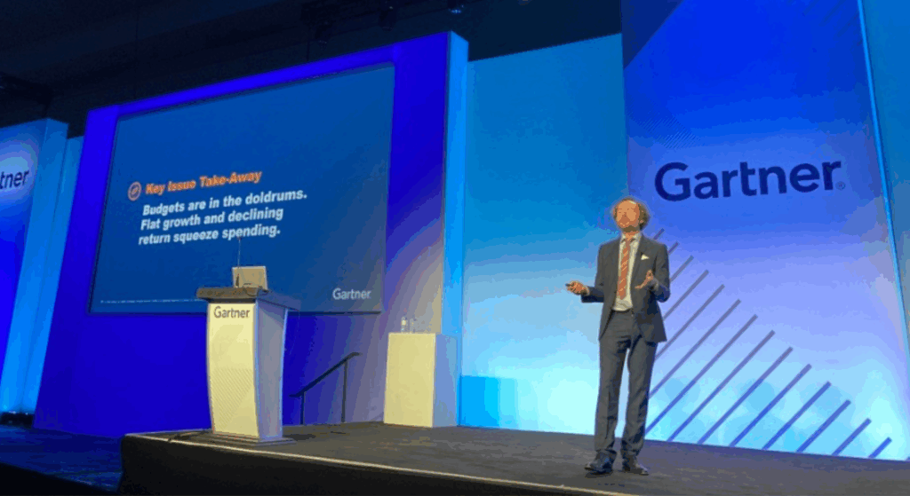 A photo of a speaker presenting at the Gartner Marketing Symposium/Xpo conference