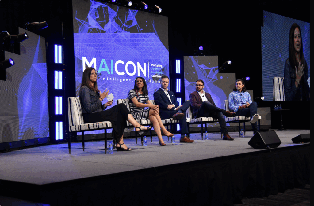 A panel of experts discusses marketing AI trends onstage at the MAICON conference