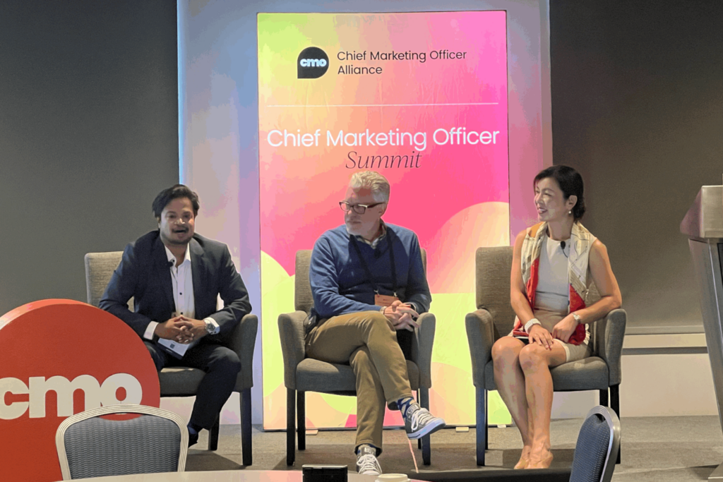 Panelists Naveen Blazey, CMO-Americas at Wipro, Chris Hood, CX,CS, and AI Executive, and Carolyn Bao, Marketing Executive, shared the stage of CMO Summit 2025 in San Francisco