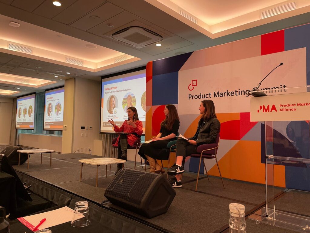 A photo of panel discussion at the Product Marketing Summit hosted by Product Marketing Alliance