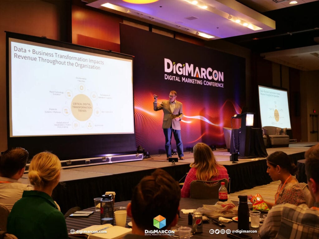 A speaker presentation on stage at the DigiMarCon