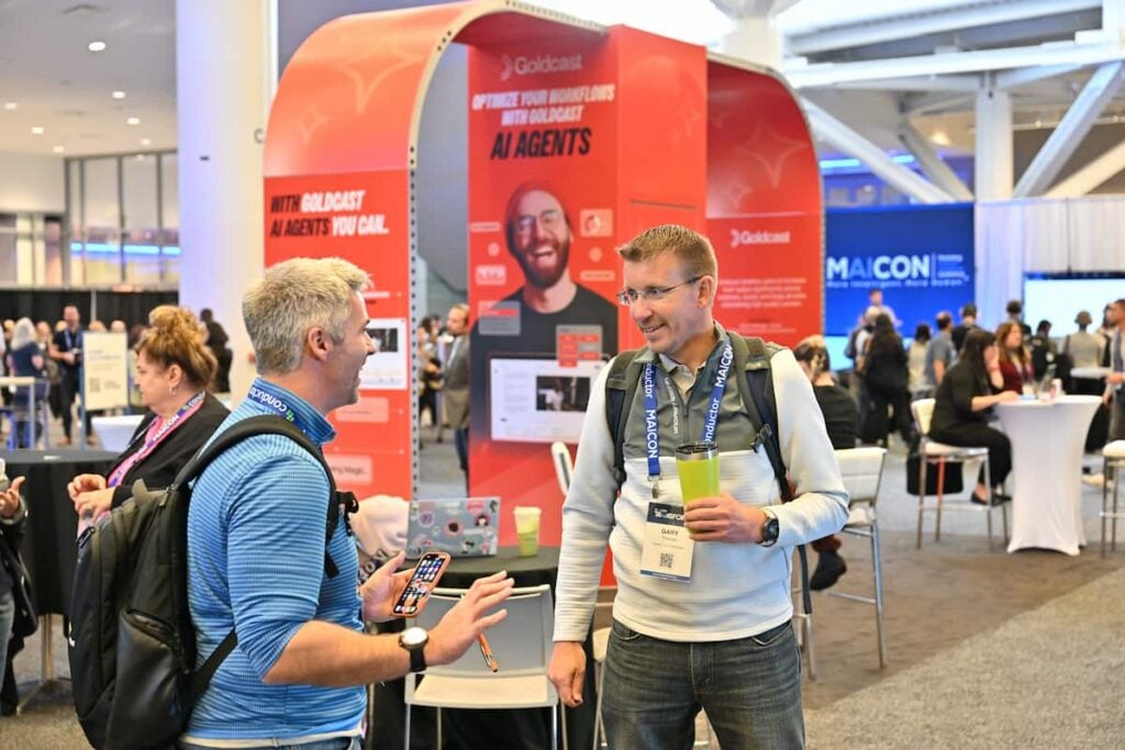 MAICON attendees networking at the event's trade show floor
