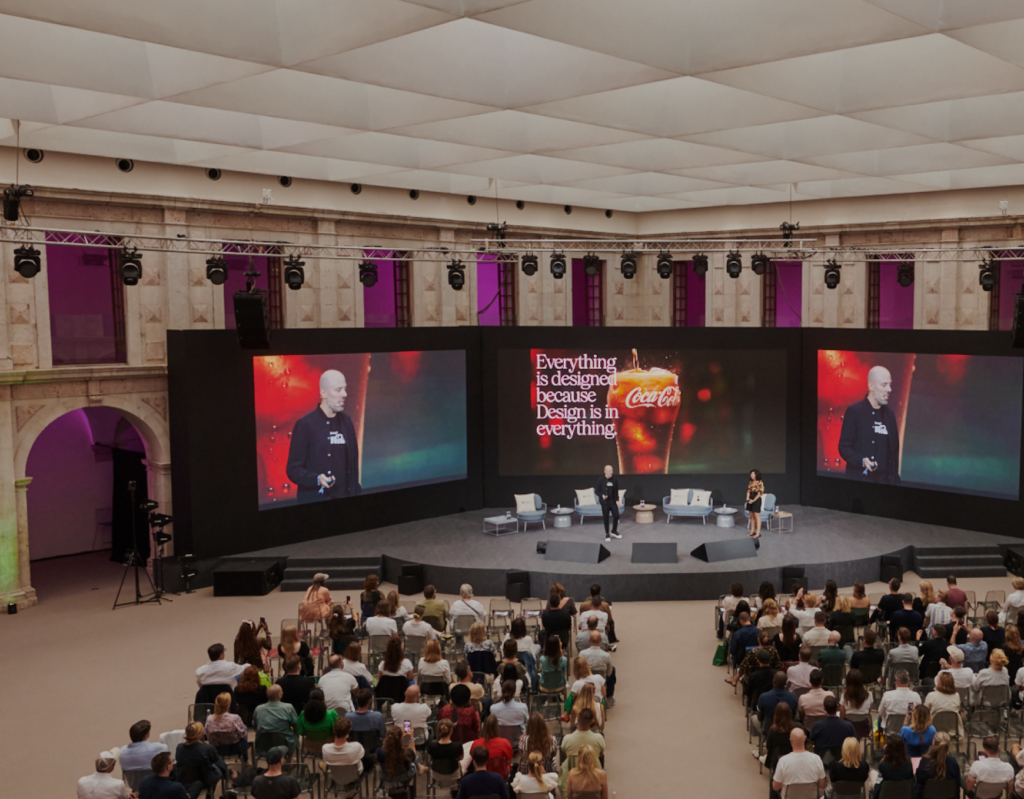 Audience watching speakers on stage at the Paradigms conference.