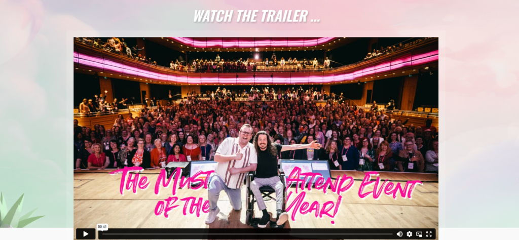 ATOMICON conference website showing a large audience and speakers on stage in Newcastle.